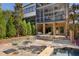 Outdoor patio with seating, dining area, and adjacent pool at 9060 Selborne Ln, Chattahoochee Hills, GA 30268