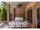 Brick patio with seating area, perfect for relaxing outdoors at 9060 Selborne Ln, Chattahoochee Hills, GA 30268