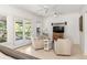 Bedroom sitting area with two armchairs and access to balcony at 9060 Selborne Ln, Chattahoochee Hills, GA 30268