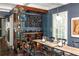 Basement wine cellar with glass doors and numerous wine bottles at 9060 Selborne Ln, Chattahoochee Hills, GA 30268