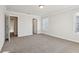 Neutral carpeted bedroom with large open space and natural lighting at 4235 Holland Grove Rd, Lawrenceville, GA 30044