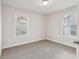 Bright bedroom with two windows and closet at 4235 Holland Grove Rd, Lawrenceville, GA 30044