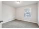 Bright bedroom with a window and closet at 4235 Holland Grove Rd, Lawrenceville, GA 30044