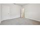 Neutral bedroom featuring a large closet and neutral carpet at 4235 Holland Grove Rd, Lawrenceville, GA 30044