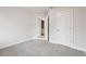 Neutral bedroom featuring a large closet and neutral carpet at 4235 Holland Grove Rd, Lawrenceville, GA 30044