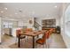 Elegant dining room with a large table, wood floors, and a modern bookcase at 4235 Holland Grove Rd, Lawrenceville, GA 30044