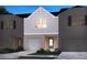 Charming exterior showcasing a well-manicured lawn and a one car garage at 4235 Holland Grove Rd, Lawrenceville, GA 30044