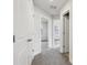 Hallway with multiple rooms and carpeted floors at 4235 Holland Grove Rd, Lawrenceville, GA 30044
