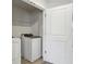 Convenient laundry room with modern washer and dryer, plus ample space at 4235 Holland Grove Rd, Lawrenceville, GA 30044