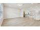 Large, open-concept living room with staircase, wood floors, and natural light at 4235 Holland Grove Rd, Lawrenceville, GA 30044