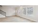 Bright, airy living room with wood floors, neutral walls, staircase, and a glass panel door at 4235 Holland Grove Rd, Lawrenceville, GA 30044