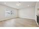Bright living room features wood floors, recessed lighting, and a large window at 4235 Holland Grove Rd, Lawrenceville, GA 30044