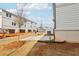 New construction homes, sidewalk, landscaping, and paved street at 4235 Holland Grove Rd, Lawrenceville, GA 30044