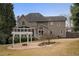 Two story house with screened porch and pergola at 1685 Terrace Lake Dr, Lawrenceville, GA 30043