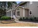 Two-story house with screened porch and landscaped yard at 1685 Terrace Lake Dr, Lawrenceville, GA 30043