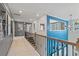 Loft overlooking the main level with gray and blue accent walls at 329 Delta Dr, Mcdonough, GA 30253