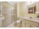 Bathroom with shower/tub combo, vanity and updated flooring at 778 Villa Way, Jonesboro, GA 30238