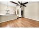 Open dining room with hardwood floors and kitchen view at 778 Villa Way, Jonesboro, GA 30238