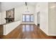Sunlit dining room, hardwood floors, stone fireplace at 778 Villa Way, Jonesboro, GA 30238