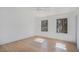 Bright bedroom with hardwood floors and two windows at 110 Maryeanna Dr, Atlanta, GA 30342