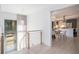 Light-filled upper hallway with view of modern kitchen and entry door at 110 Maryeanna Dr, Atlanta, GA 30342