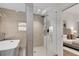 Modern bathroom with a freestanding tub and glass-enclosed shower with a door leading to the main bedroom at 110 Maryeanna Ne Dr, Atlanta, GA 30342