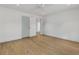 Spacious bedroom featuring hardwood floors, white walls, and a ceiling fan at 110 Maryeanna Ne Dr, Atlanta, GA 30342