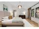 The main bedroom features contemporary furnishings, hardwood floors, and ample natural light at 110 Maryeanna Ne Dr, Atlanta, GA 30342