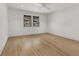 Bright bedroom featuring hardwood floors, and two windows at 110 Maryeanna Ne Dr, Atlanta, GA 30342