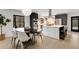 Modern kitchen featuring stainless steel appliances, a large island, and an adjacent dining area at 110 Maryeanna Ne Dr, Atlanta, GA 30342
