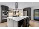 Well-equipped kitchen with island, gas cooktop, modern appliances, and barstool seating at 110 Maryeanna Ne Dr, Atlanta, GA 30342