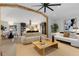 Open-concept living space with modern furnishings and a view into the dining area and kitchen at 110 Maryeanna Ne Dr, Atlanta, GA 30342