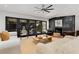 Cozy living room with modern decor, fireplace, and sliding glass doors leading to an outdoor area at 110 Maryeanna Ne Dr, Atlanta, GA 30342