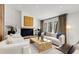 Elegant living room boasting a cozy fireplace, stylish furniture, and ample natural light at 110 Maryeanna Ne Dr, Atlanta, GA 30342