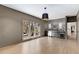 Bright living room featuring a wet bar, large windows, and hardwood floors at 110 Maryeanna Ne Dr, Atlanta, GA 30342