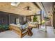 Covered outdoor seating area featuring comfortable sofas and a ceiling fan at 110 Maryeanna Ne Dr, Atlanta, GA 30342