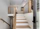 Inviting staircase with wood and steel railings, creating a modern and stylish entryway at 110 Maryeanna Ne Dr, Atlanta, GA 30342