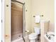 Bathroom featuring tiled shower, toilet, and tub with neutral colored walls at 560 Dutch Valley Ne Rd # 209, Atlanta, GA 30324
