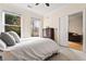 Bedroom featuring a plush bed and a view to the sitting room through sliding doors at 560 Dutch Valley Ne Rd # 209, Atlanta, GA 30324