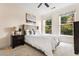 Bedroom with a upholstered bed, and large windows providing ample natural light at 560 Dutch Valley Ne Rd # 209, Atlanta, GA 30324