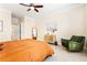 Inviting bedroom with a ceiling fan, large windows and an accent chair at 560 Dutch Valley Ne Rd # 209, Atlanta, GA 30324