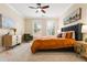 Cozy bedroom featuring neutral colors, ceiling fan, and window with shutters at 560 Dutch Valley Ne Rd # 209, Atlanta, GA 30324