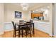 Inviting dining room featuring modern light fixture, hardwood floors, and neutral colors at 560 Dutch Valley Ne Rd # 209, Atlanta, GA 30324