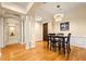 Elegant dining room featuring chandelier, hardwood floors, and adjacent living spaces at 560 Dutch Valley Ne Rd # 209, Atlanta, GA 30324