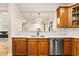 Bright kitchen featuring wood cabinets, stainless steel dishwasher and a white countertop at 560 Dutch Valley Ne Rd # 209, Atlanta, GA 30324