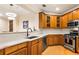 Well-equipped kitchen with stainless steel appliances, granite countertops, and wooden cabinets at 560 Dutch Valley Ne Rd # 209, Atlanta, GA 30324