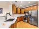 Well-lit kitchen with stainless steel appliances, white countertops, and wooden cabinets at 560 Dutch Valley Ne Rd # 209, Atlanta, GA 30324