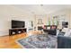 Comfortable living room with a fireplace, stylish rug, and access to outdoor space at 560 Dutch Valley Ne Rd # 209, Atlanta, GA 30324