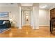 Bright and open living room featuring classic columns and hardwood floors at 560 Dutch Valley Ne Rd # 209, Atlanta, GA 30324