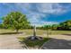 Open green space with a central sculpture and walking paths, under a blue sky with fluffy white clouds at 560 Dutch Valley Ne Rd # 209, Atlanta, GA 30324